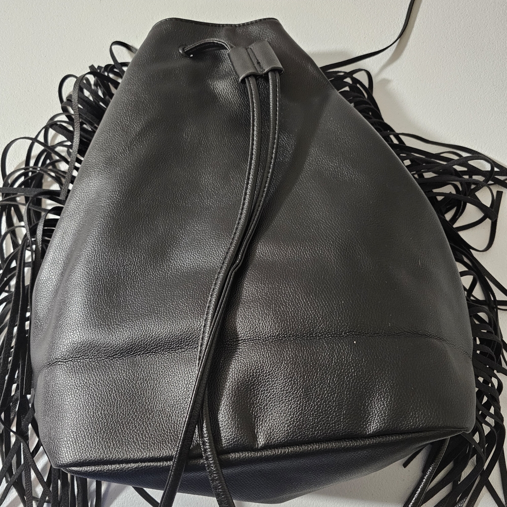 Victoria's Secret black faux leather fringe drawstring backpack.